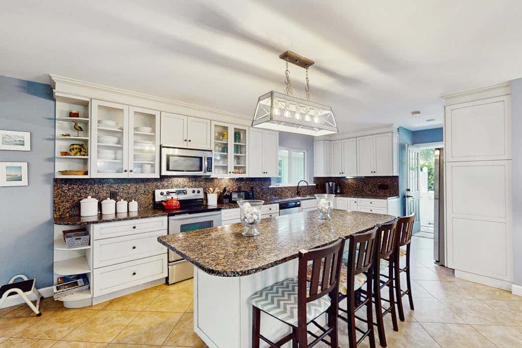 Home with private pool, fenced in yard, dog-friendly, walk to beach