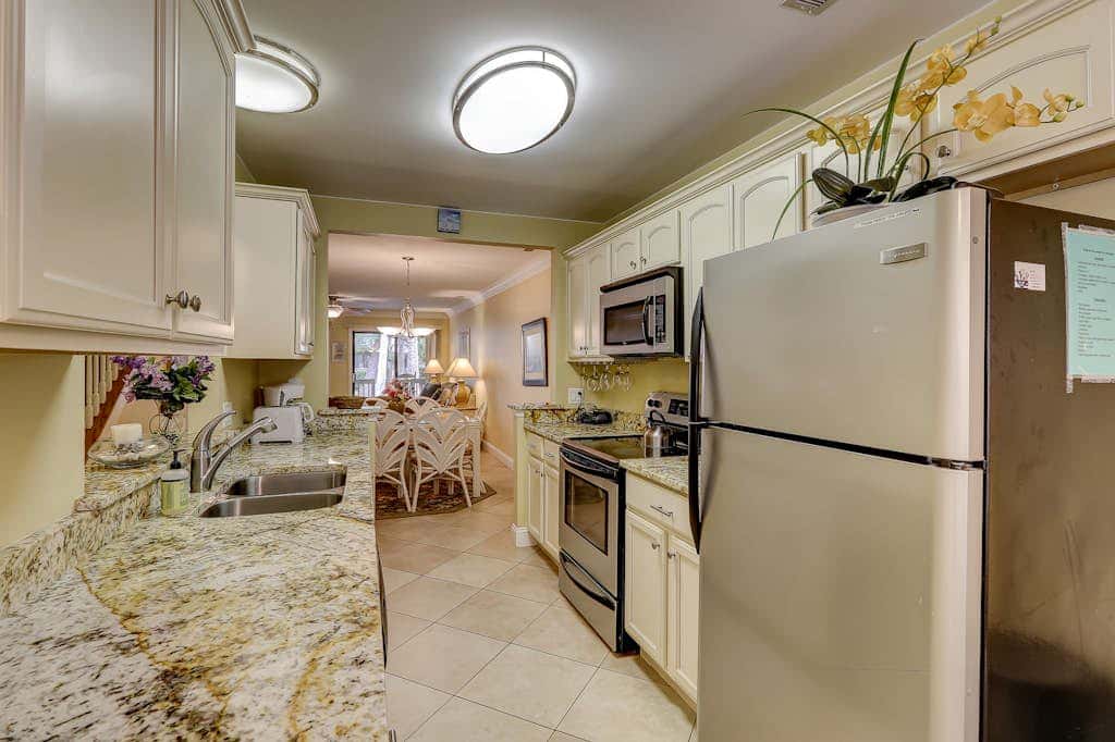 Beautifully remodeled villa with WiFi, inviting porch & balconies walk to beach