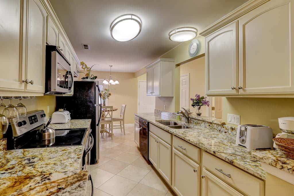 Beautifully remodeled villa with WiFi, inviting porch & balconies walk to beach