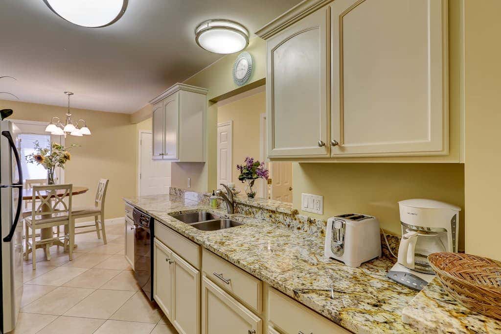Beautifully remodeled villa with WiFi, inviting porch & balconies walk to beach