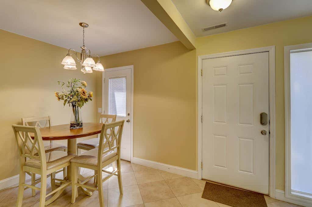 Beautifully remodeled villa with WiFi, inviting porch & balconies walk to beach