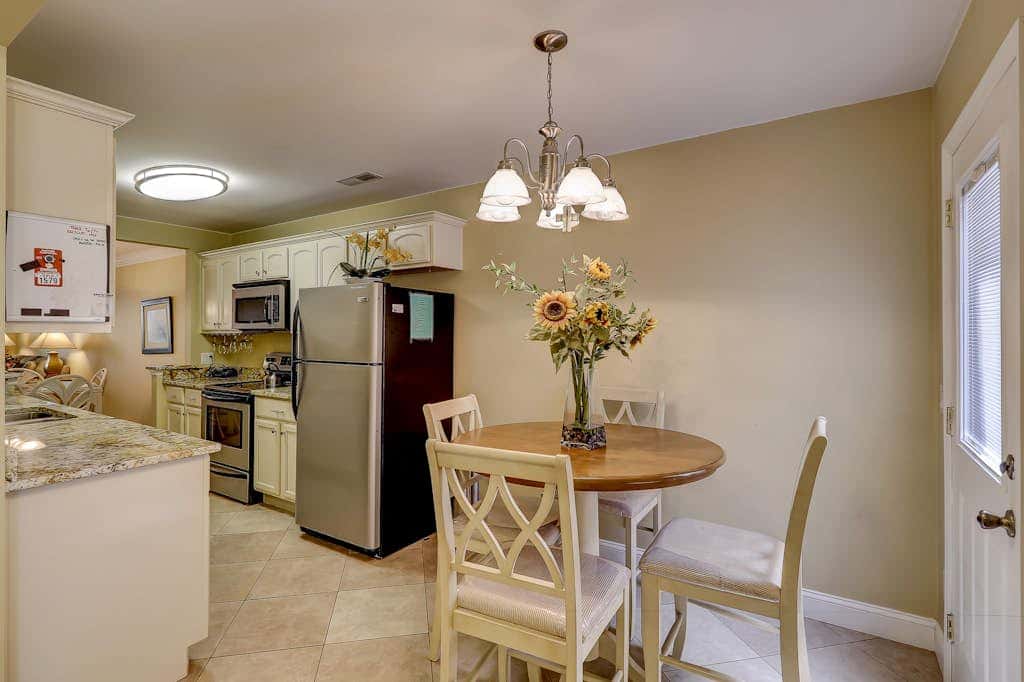 Beautifully remodeled villa with WiFi, inviting porch & balconies walk to beach