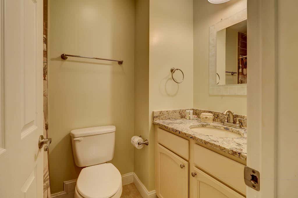Beautifully remodeled villa with WiFi, inviting porch & balconies walk to beach