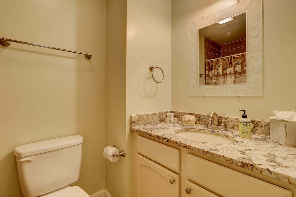 Beautifully remodeled villa with WiFi, inviting porch & balconies walk to beach