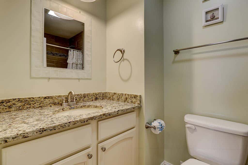 Beautifully remodeled villa with WiFi, inviting porch & balconies walk to beach