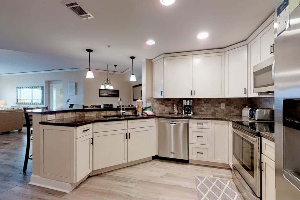 Dreamy condo on the beach with balcony view, shared pool, & charming decor