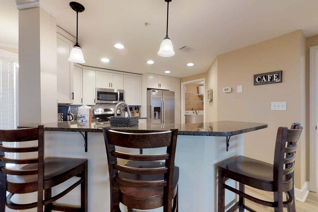 Dreamy condo on the beach with balcony view, shared pool, & charming decor