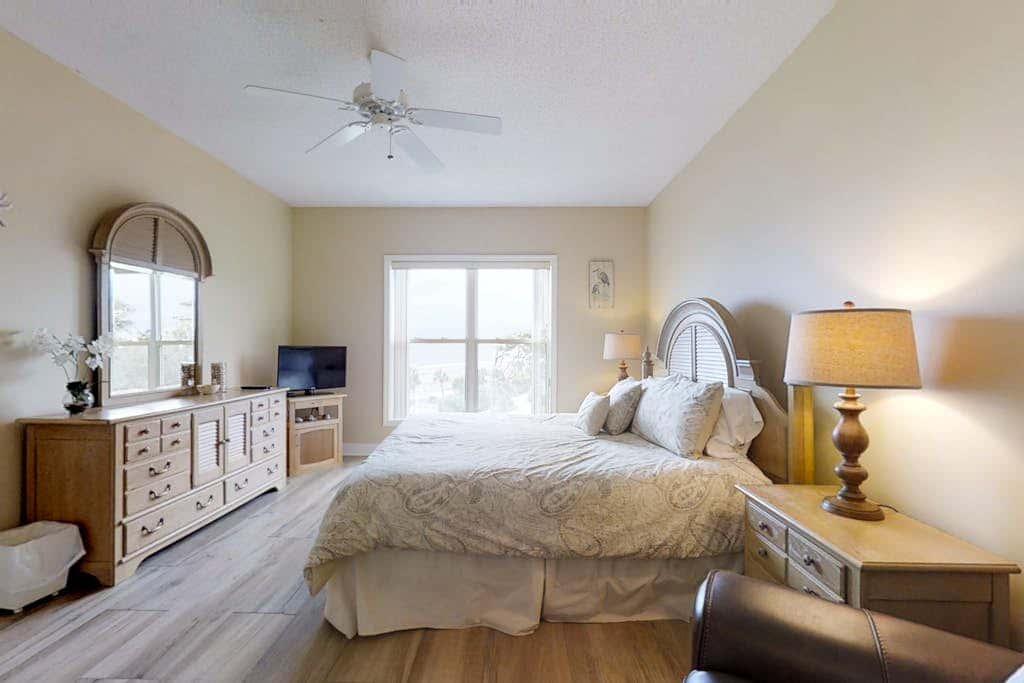 Dreamy condo on the beach with balcony view, shared pool, & charming decor