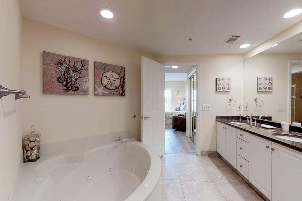 Dreamy condo on the beach with balcony view, shared pool, & charming decor