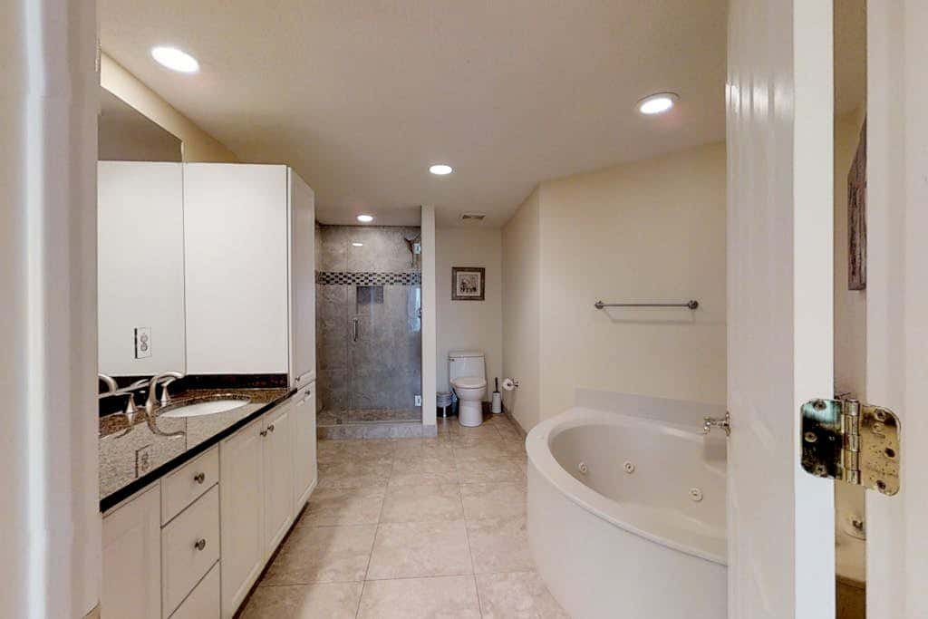 Dreamy condo on the beach with balcony view, shared pool, & charming decor