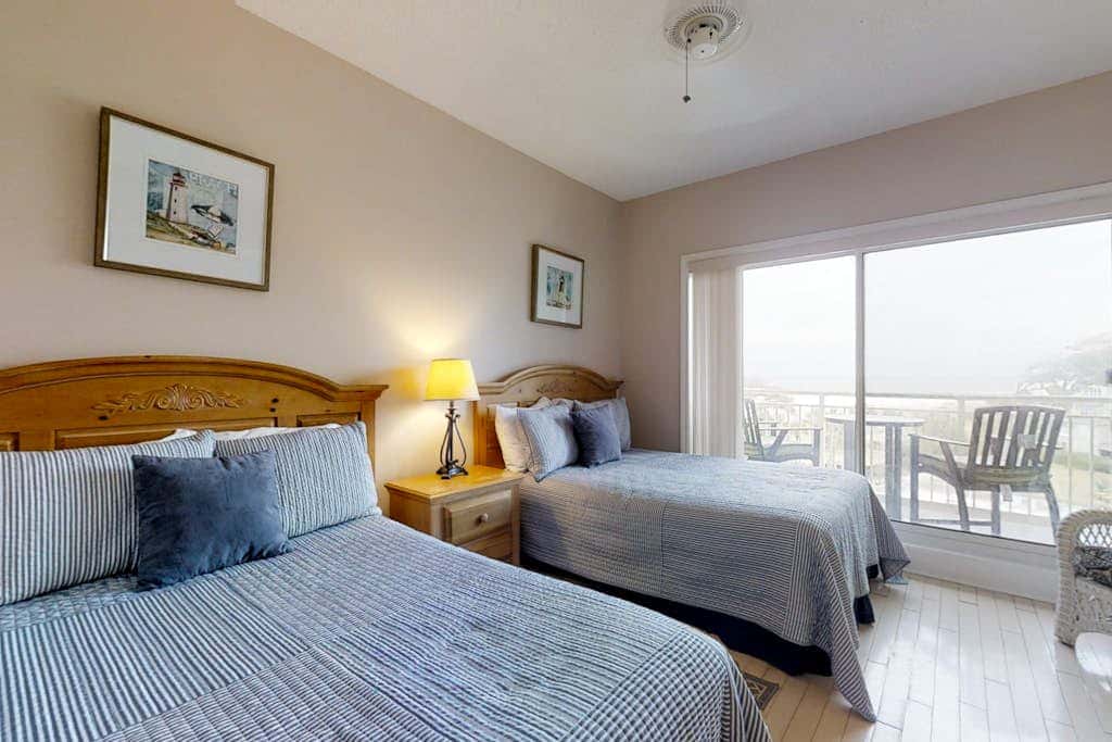 Dreamy condo on the beach with balcony view, shared pool, & charming decor