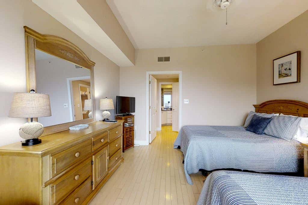 Dreamy condo on the beach with balcony view, shared pool, & charming decor