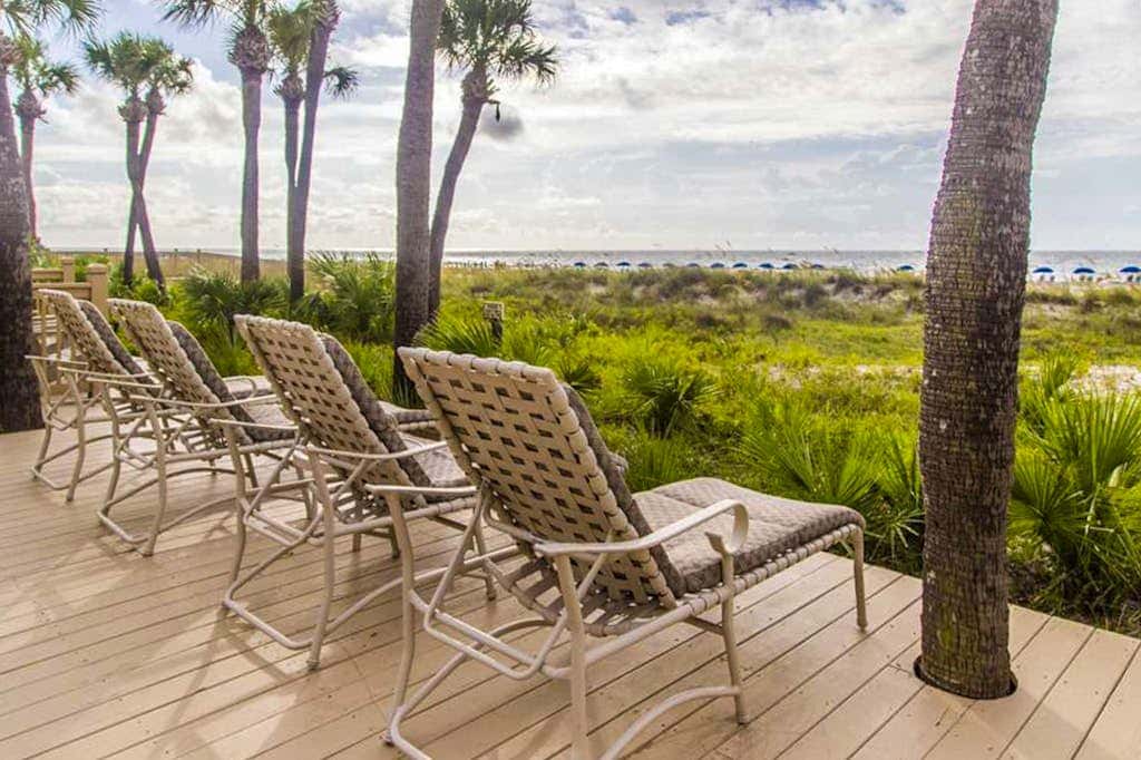 Dreamy condo on the beach with balcony view, shared pool, & charming decor
