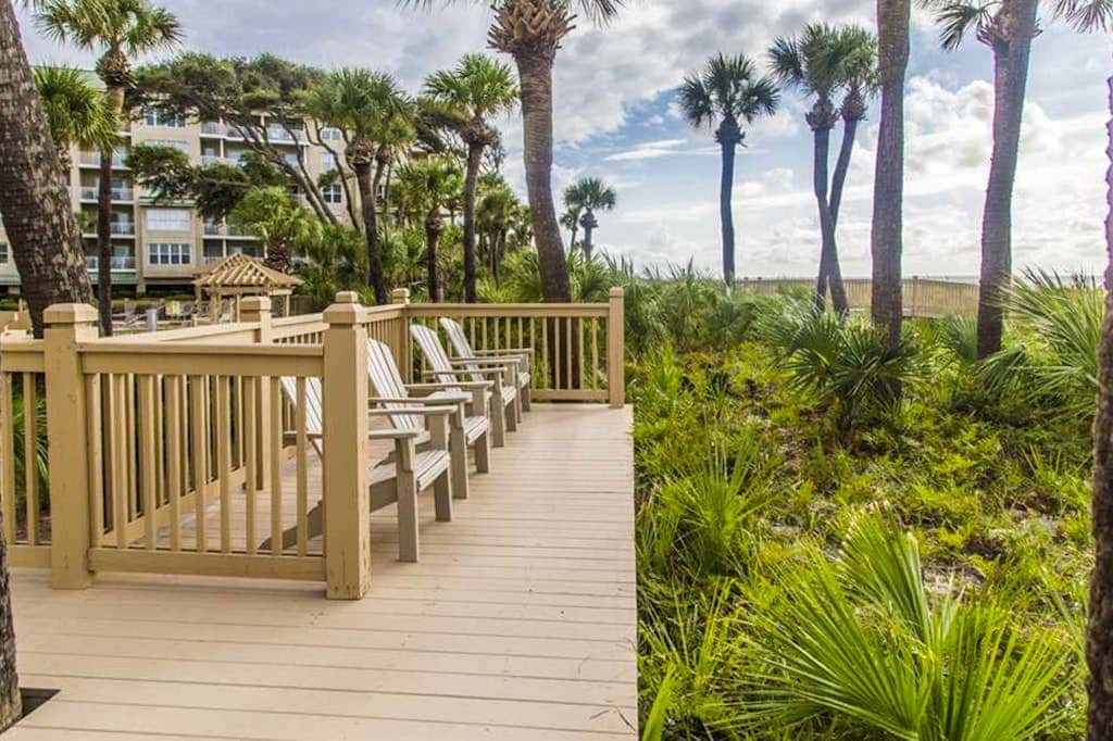 Dreamy condo on the beach with balcony view, shared pool, & charming decor