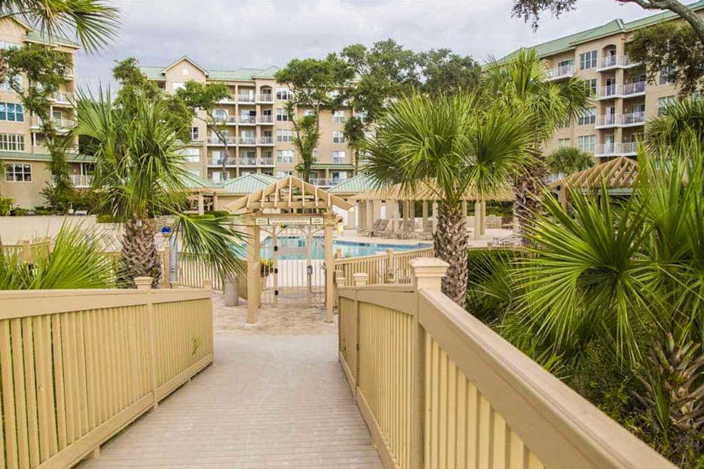 Dreamy condo on the beach with balcony view, shared pool, & charming decor