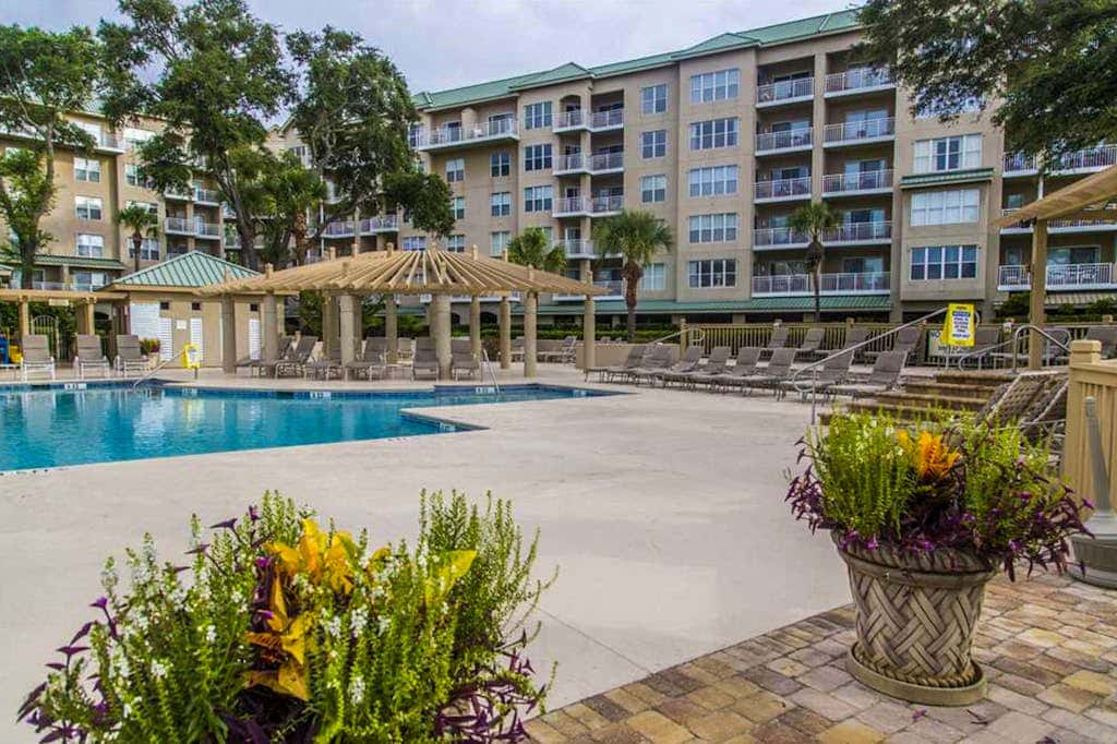 Dreamy condo on the beach with balcony view, shared pool, & charming decor