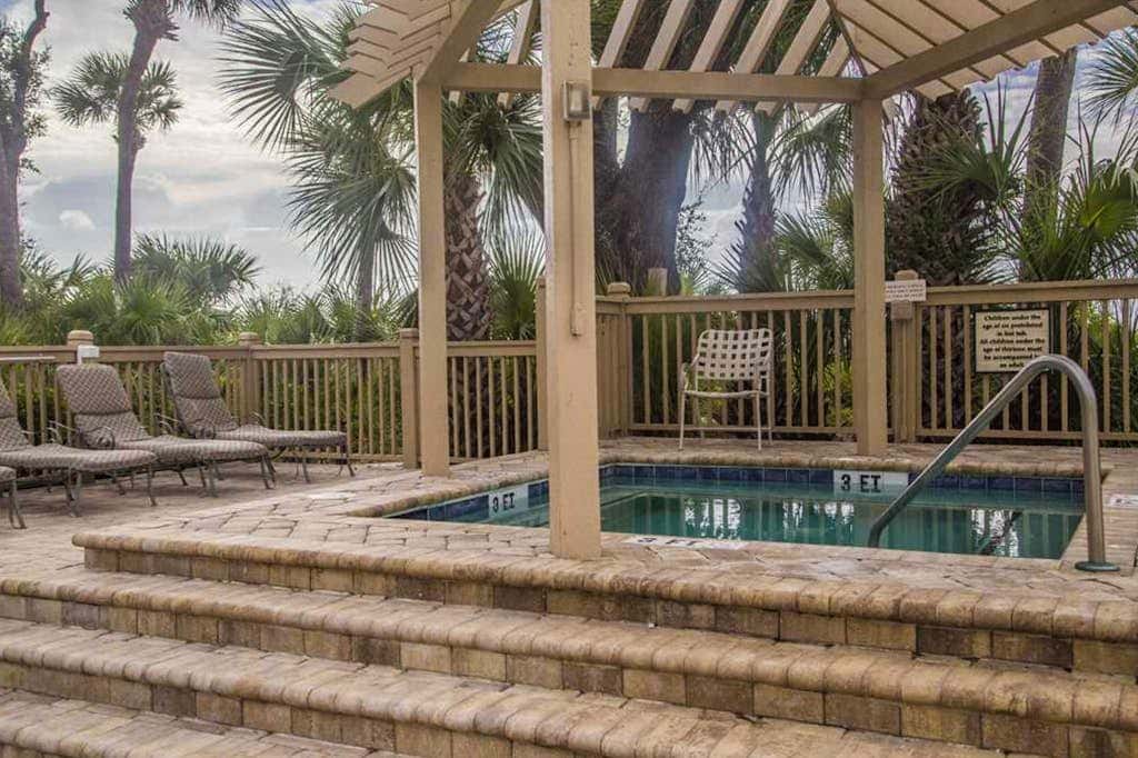 Dreamy condo on the beach with balcony view, shared pool, & charming decor