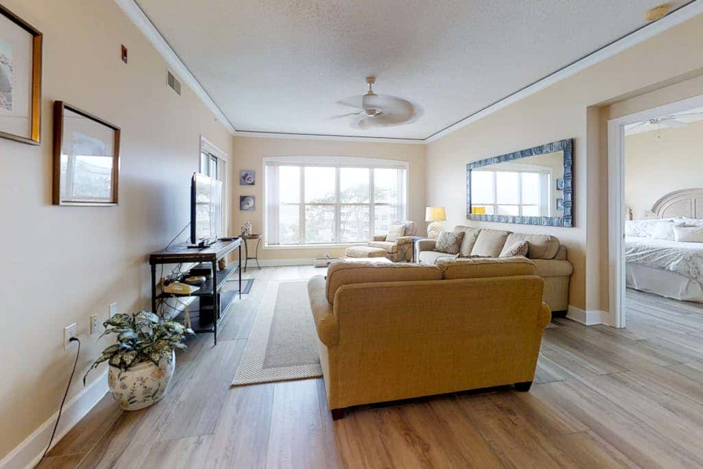 Dreamy condo on the beach with balcony view, shared pool, & charming decor