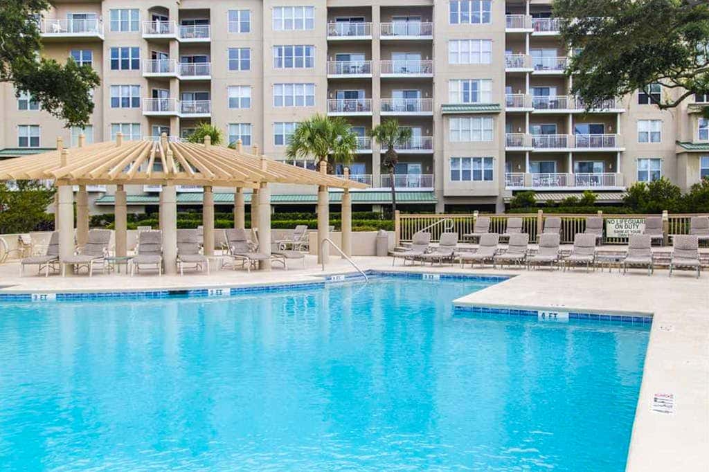 Dreamy condo on the beach with balcony view, shared pool, & charming decor