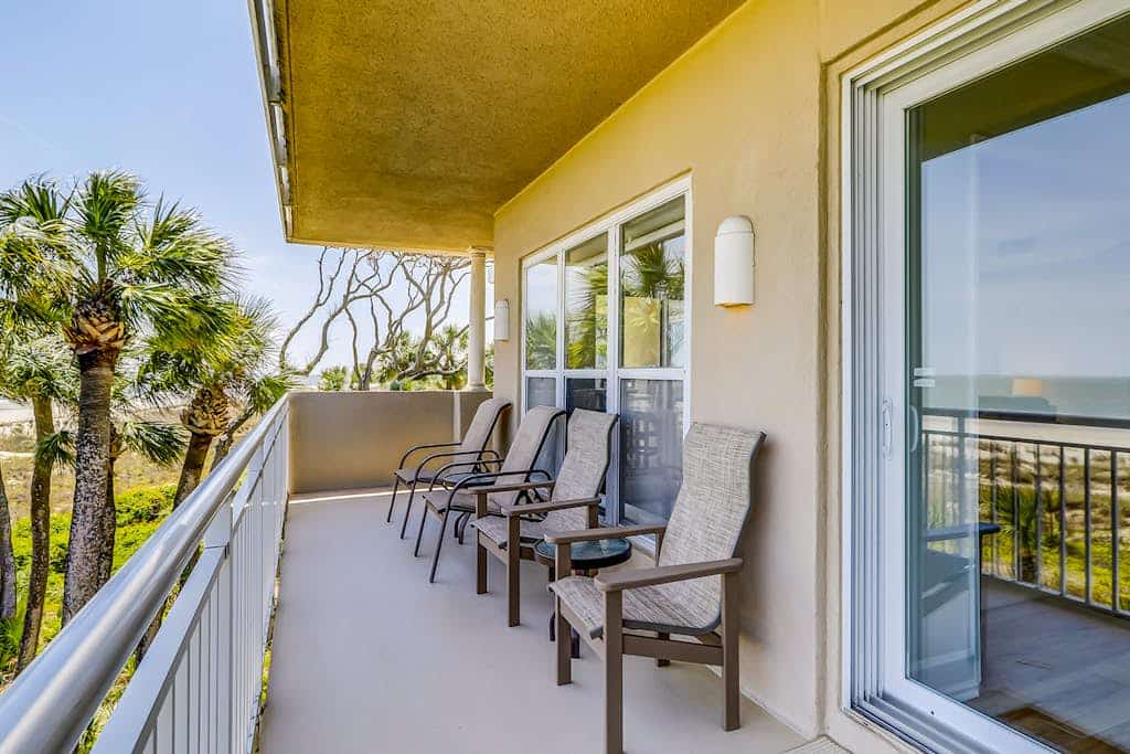 Corner condo with panoramic view & wraparound deck, just steps from the water