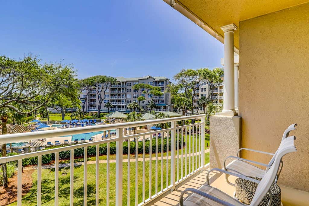 Corner condo with panoramic view & wraparound deck, just steps from the water