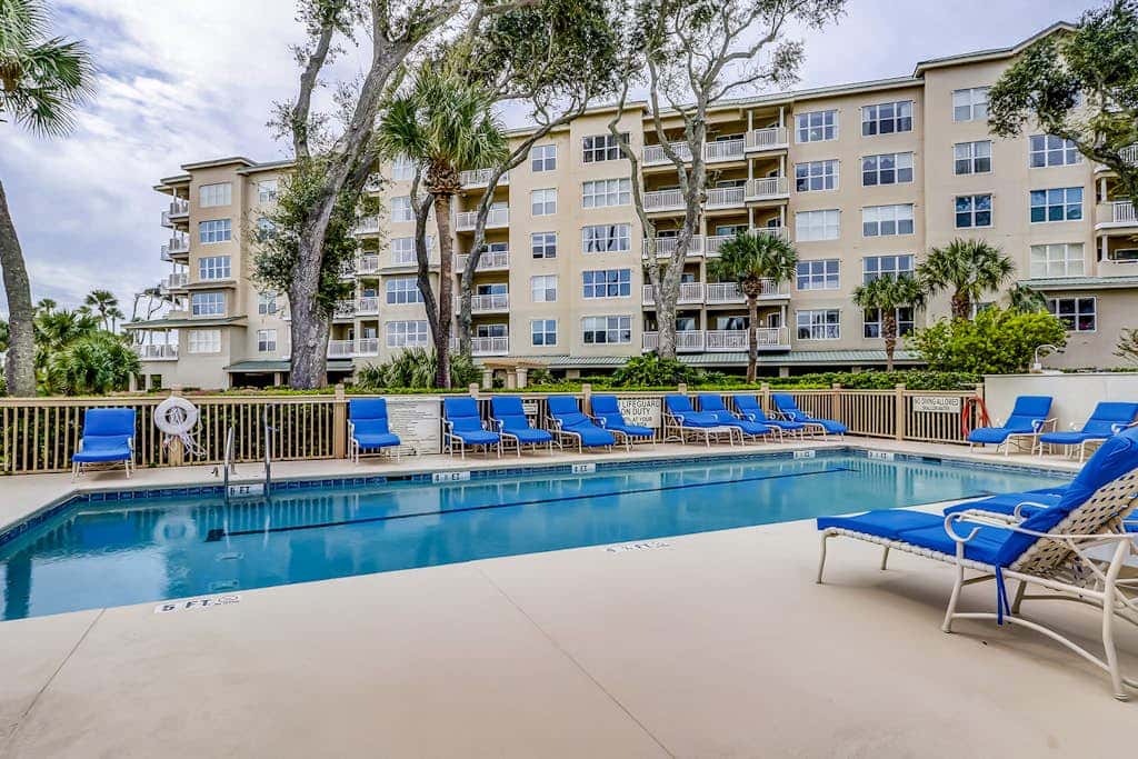 Corner condo with panoramic view & wraparound deck, just steps from the water