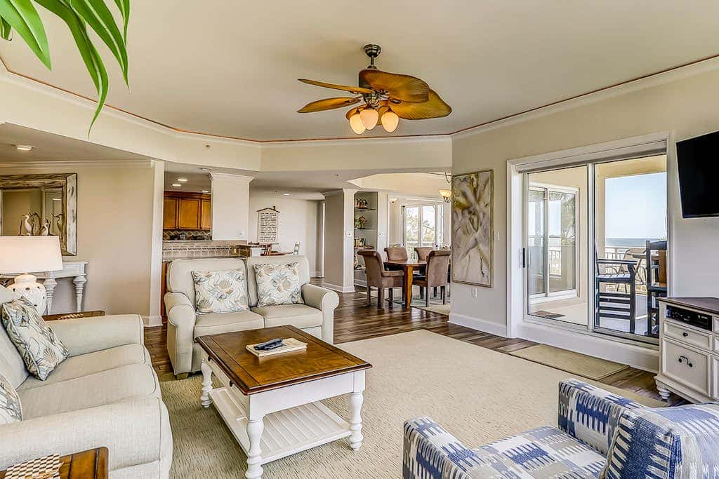 Corner condo with panoramic view & wraparound deck, just steps from the water