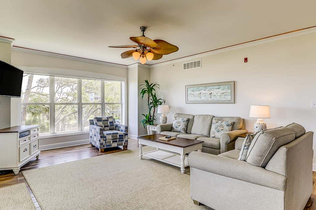 Corner condo with panoramic view & wraparound deck, just steps from the water