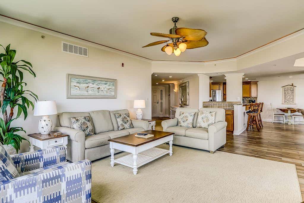 Corner condo with panoramic view & wraparound deck, just steps from the water