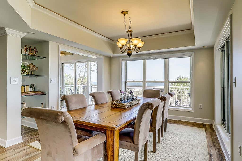 Corner condo with panoramic view & wraparound deck, just steps from the water