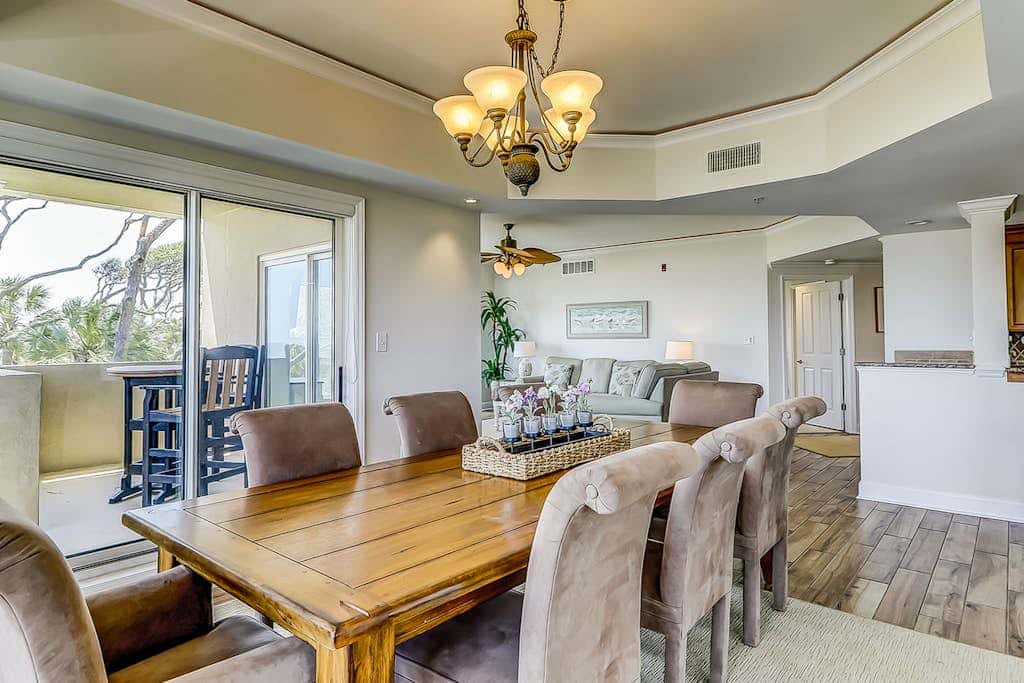Corner condo with panoramic view & wraparound deck, just steps from the water