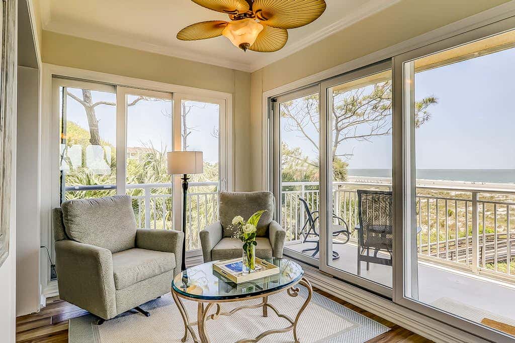 Corner condo with panoramic view & wraparound deck, just steps from the water