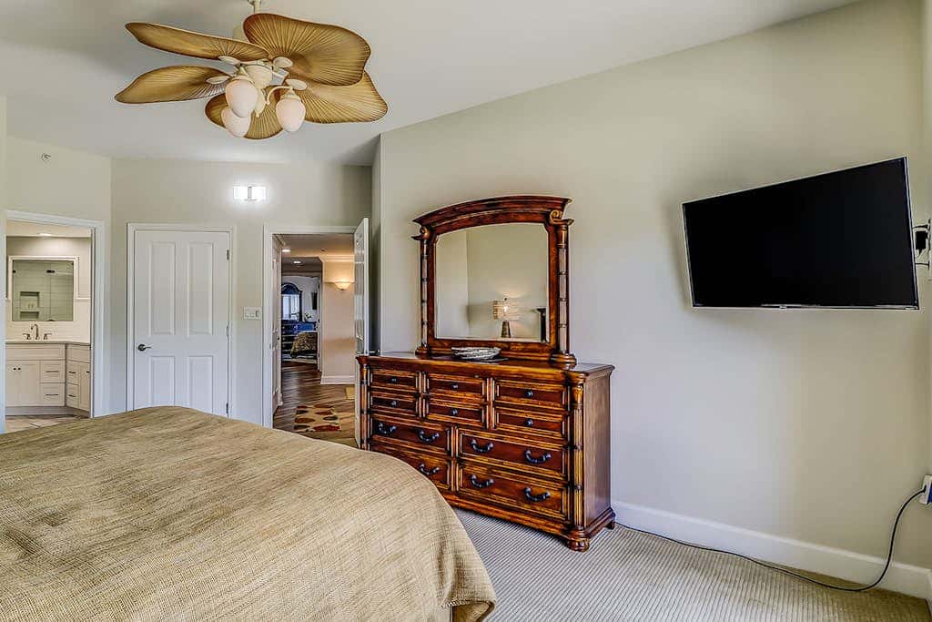 Corner condo with panoramic view & wraparound deck, just steps from the water