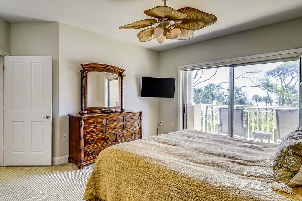 Corner condo with panoramic view & wraparound deck, just steps from the water