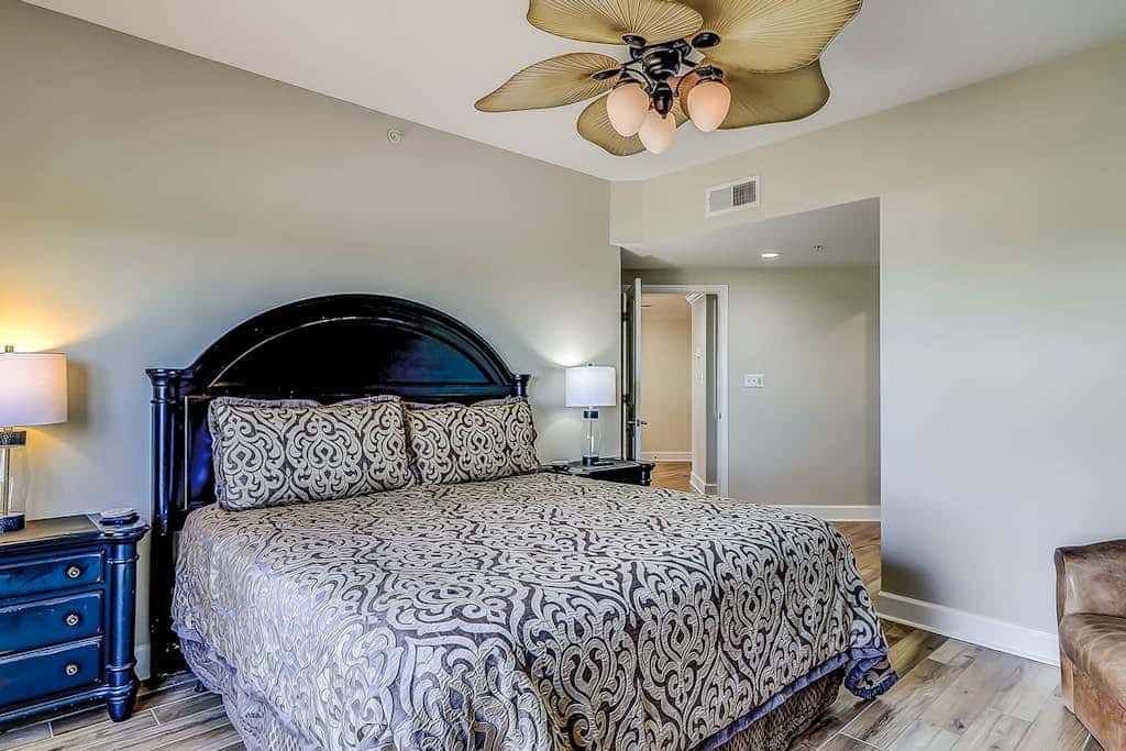 Corner condo with panoramic view & wraparound deck, just steps from the water