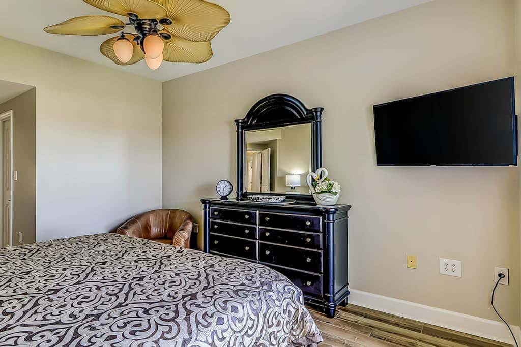 Corner condo with panoramic view & wraparound deck, just steps from the water