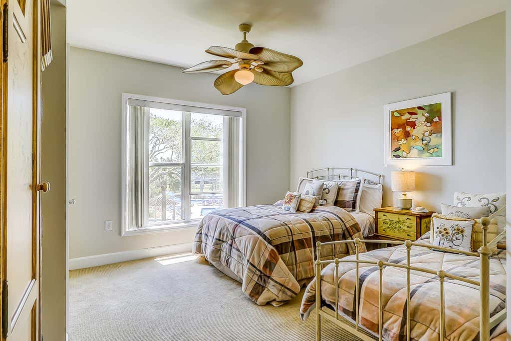 Corner condo with panoramic view & wraparound deck, just steps from the water