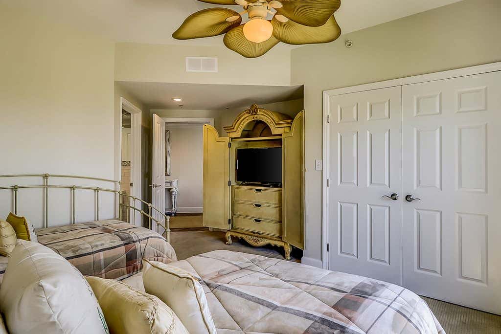 Corner condo with panoramic view & wraparound deck, just steps from the water