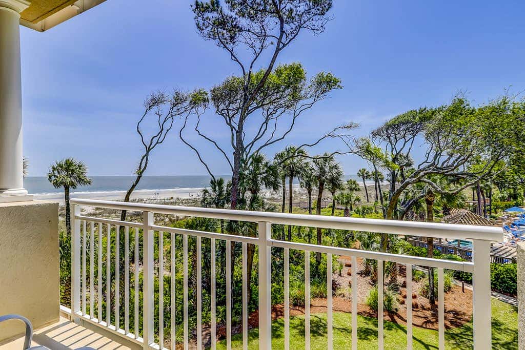 Corner condo with panoramic view & wraparound deck, just steps from the water