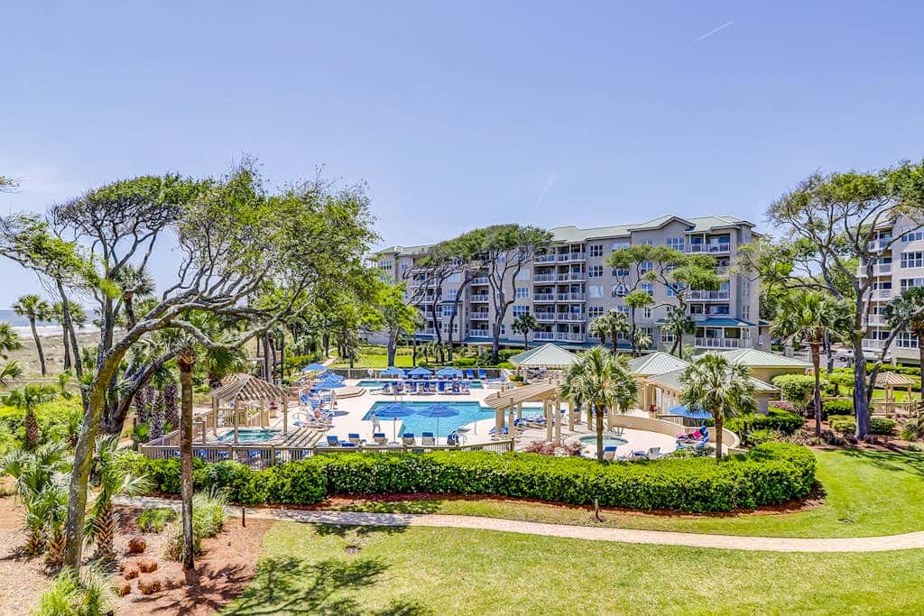 Corner condo with panoramic view & wraparound deck, just steps from the water