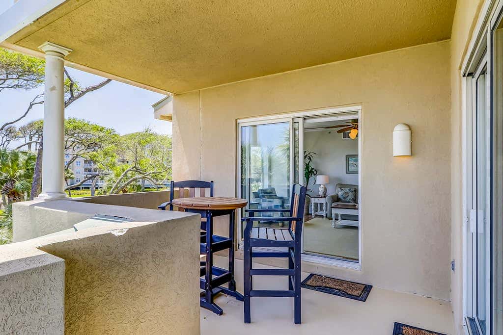 Corner condo with panoramic view & wraparound deck, just steps from the water