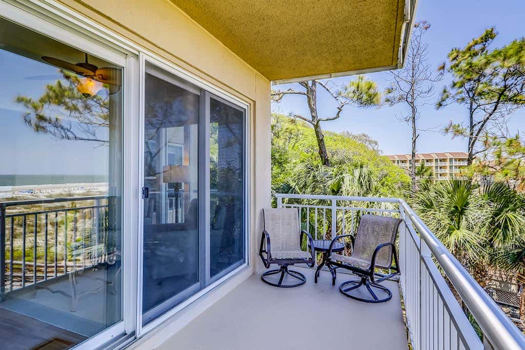 Corner condo with panoramic view & wraparound deck, just steps from the water