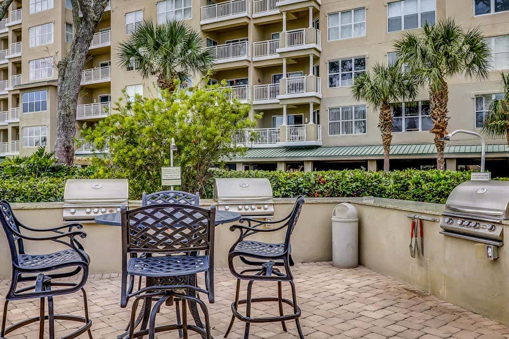 Corner condo with panoramic view & wraparound deck, just steps from the water