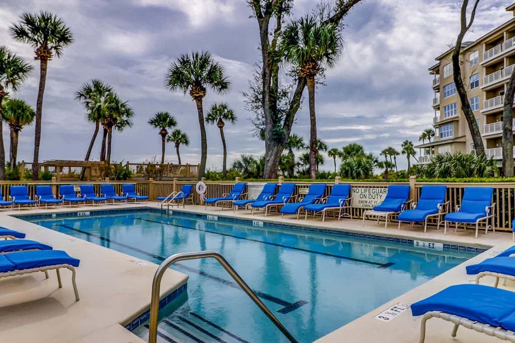 Corner condo with panoramic view & wraparound deck, just steps from the water