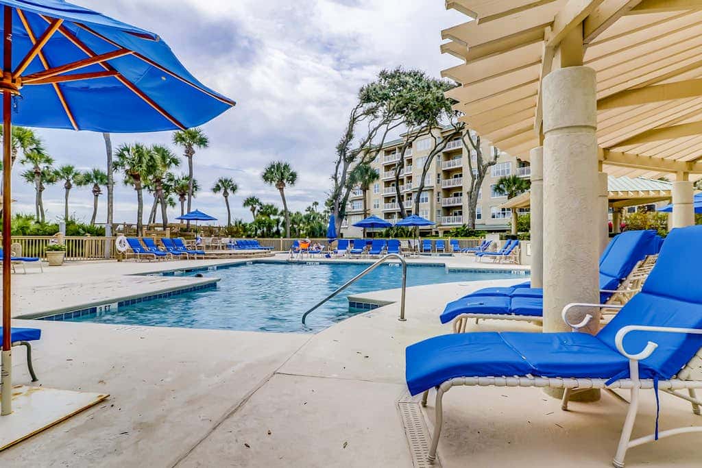 Corner condo with panoramic view & wraparound deck, just steps from the water