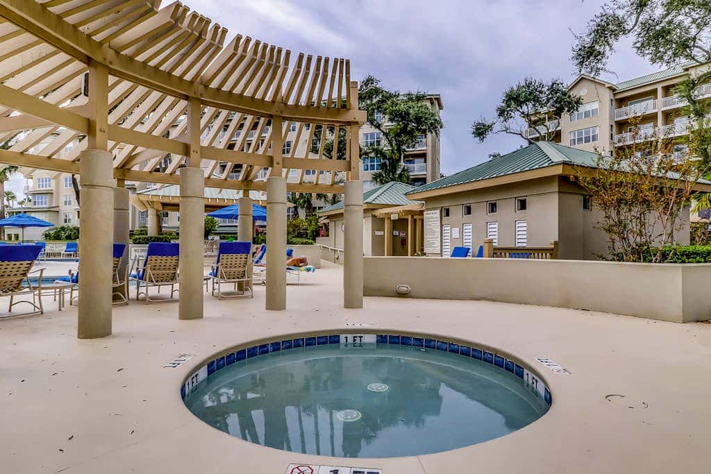 Corner condo with panoramic view & wraparound deck, just steps from the water