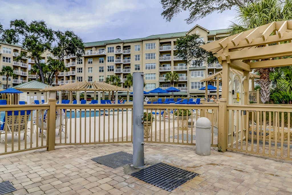 Corner condo with panoramic view & wraparound deck, just steps from the water