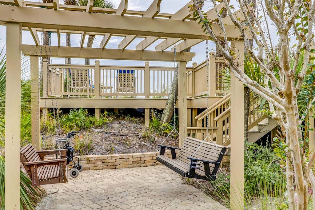 Corner condo with panoramic view & wraparound deck, just steps from the water