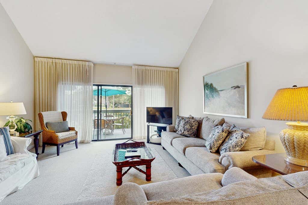 Condo with soaring ceilings, a deck, lagoon views, & shared tennis