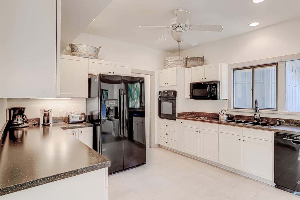 Dog friendly home with an enclosed yard, pool deck, & private pool